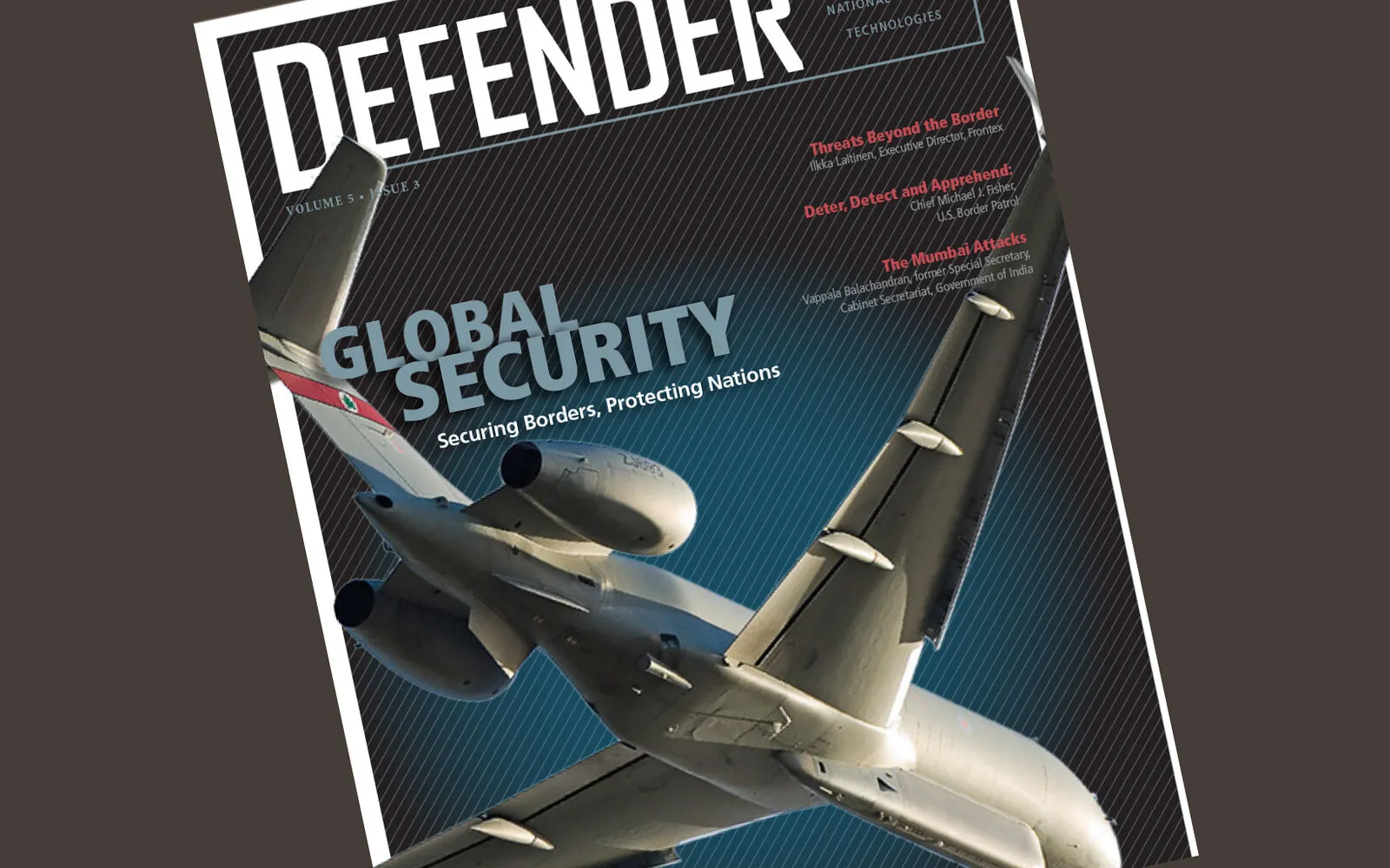 Defender magazine cover — a surveillance jet banking over a 'Global Security' headline.